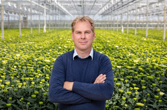 Picture of Conrad Doorn in greenhouse