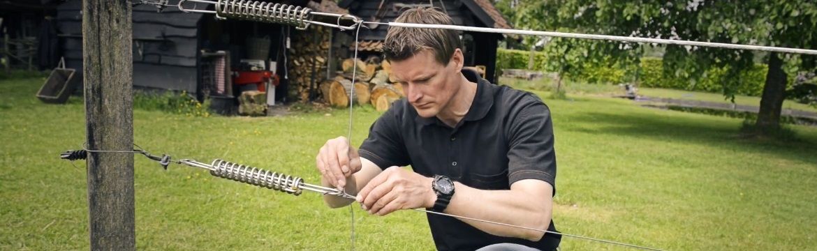 Specialist working on an electric fence 