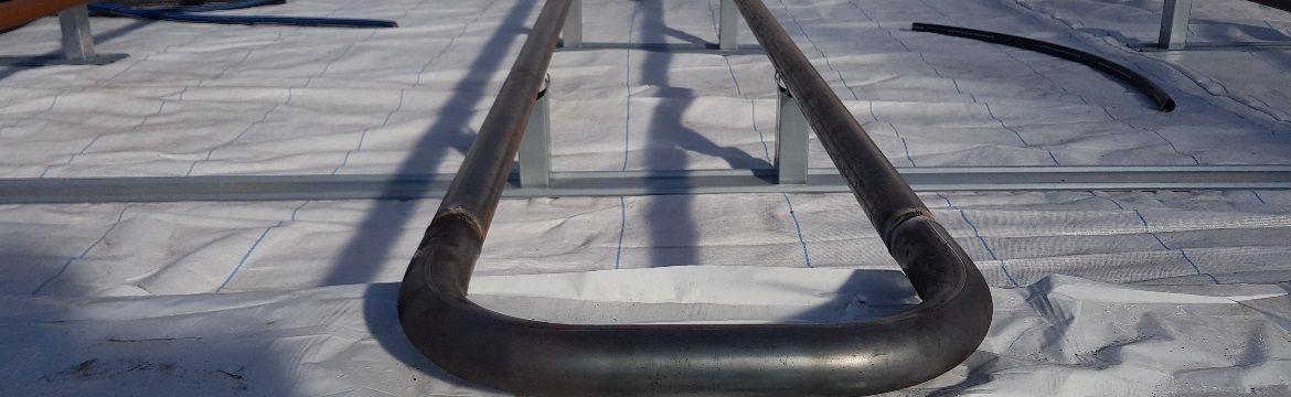 Heating pipes in a greenhouse